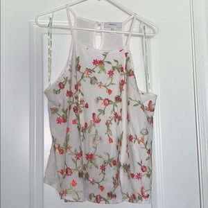 White tank top, has pink and orange flowers on it